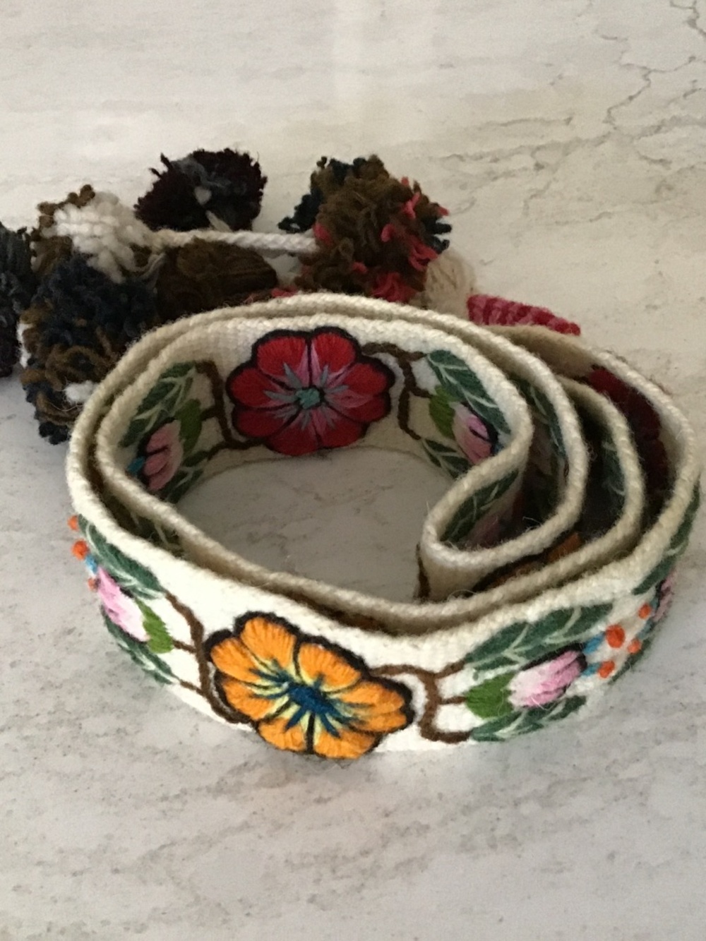 Embroidered belt with Pom poms